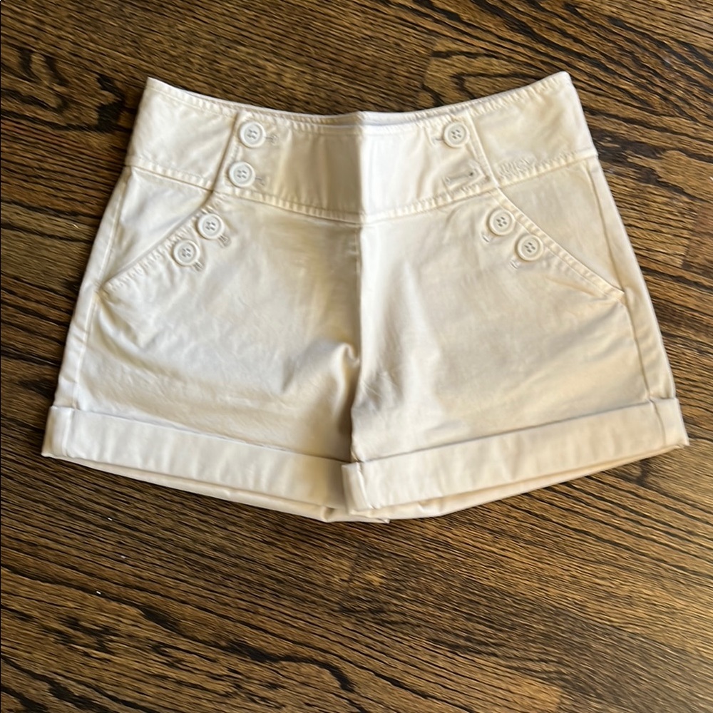 Vintage Juicy Couture Cream Bermuda Shorts with Tailored Cuffed Design